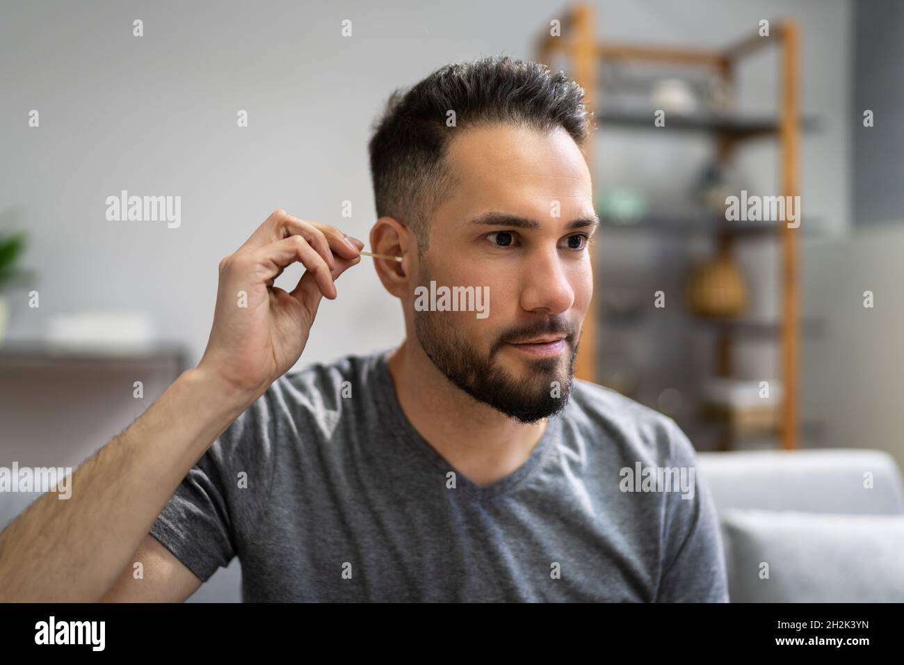 Ear Cleaning Health Hygiene. Man Using Cotton Swab Stock Photo Alamy