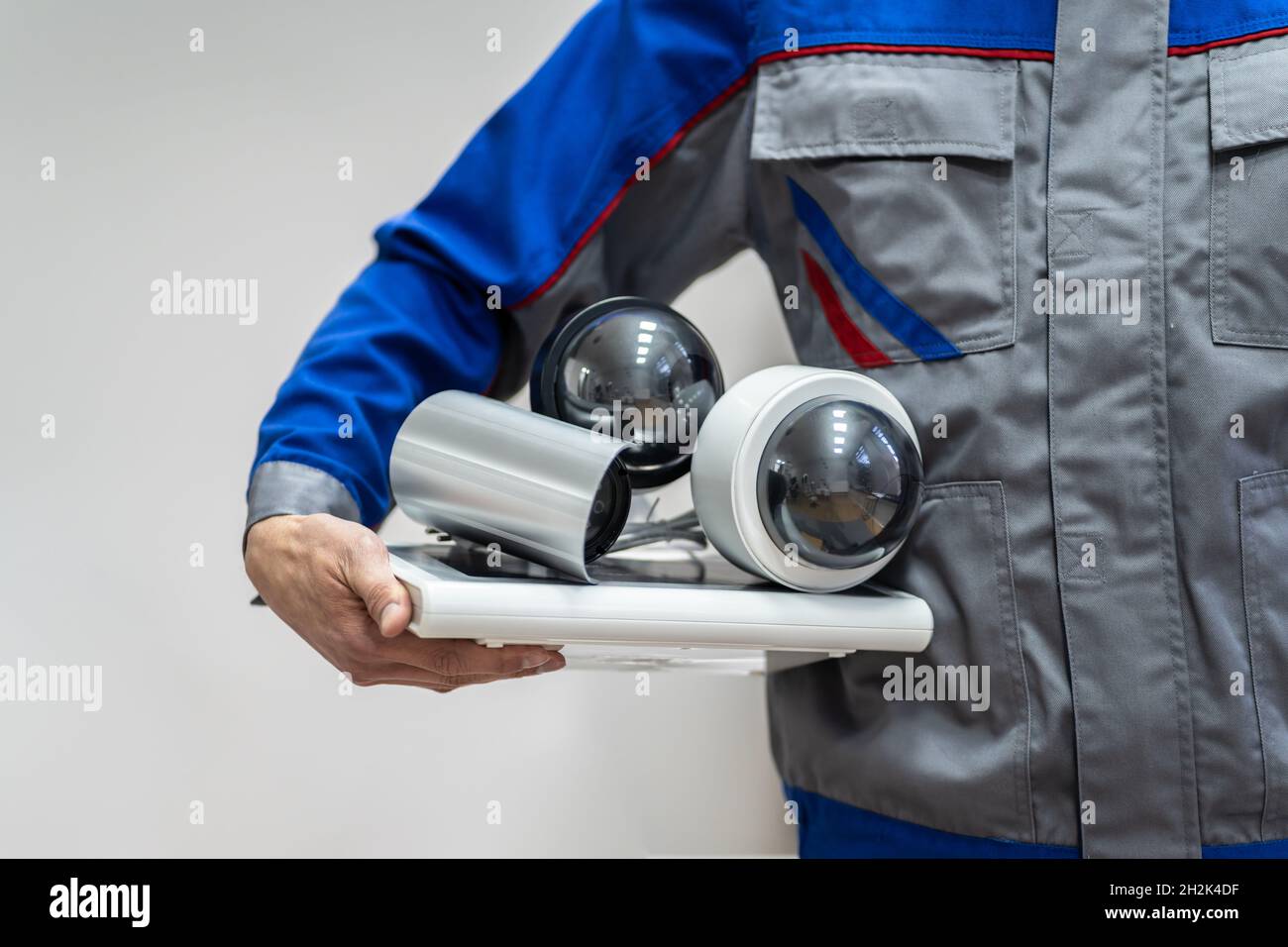 Technician Using Surveillance Security Camera Video System Stock Photo