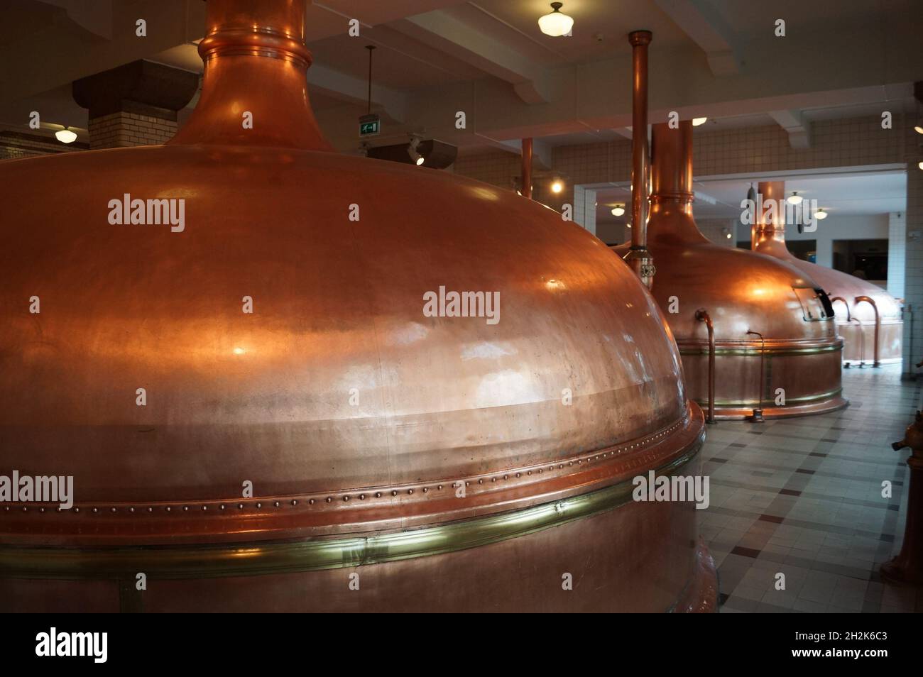 Amsterdam, Netherlands: The Heineken Experience: copper pot stills inside the brewery Stock Photo