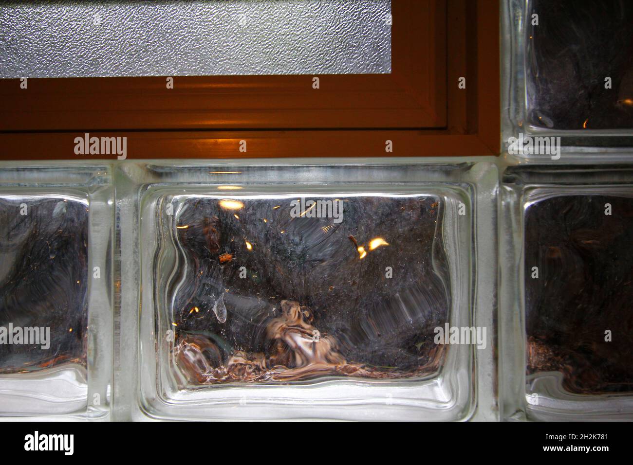 Glass block window with air vent in a basement Stock Photo Alamy