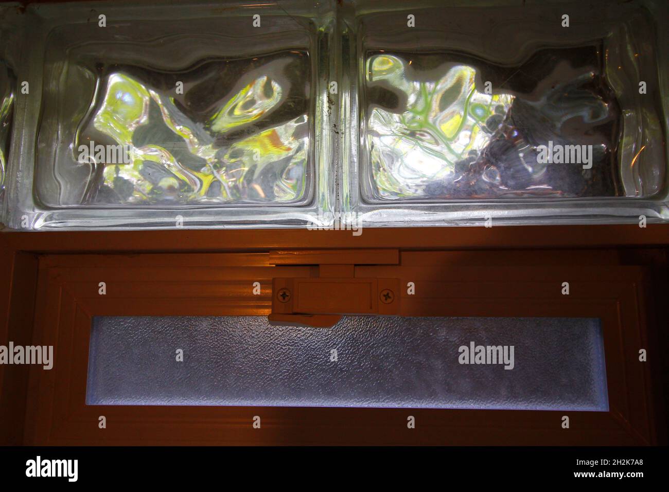 Glass block window with air vent in a basement Stock Photo Alamy