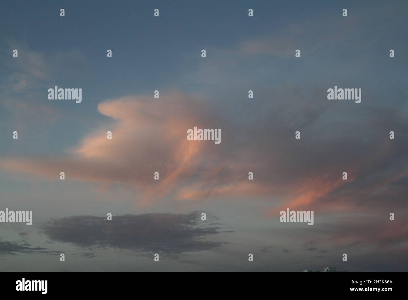 Beautiful grey and pink clouds may be used as background Stock Photo