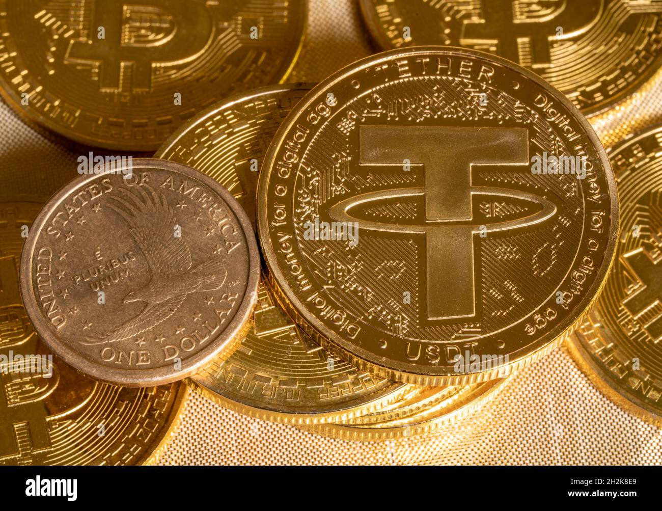 Concept of Tether coin against golden bitcoin coins and a single US dollar  coin. Tether is backed by US dollar and used for trading in alt coins Stock  Photo - Alamy