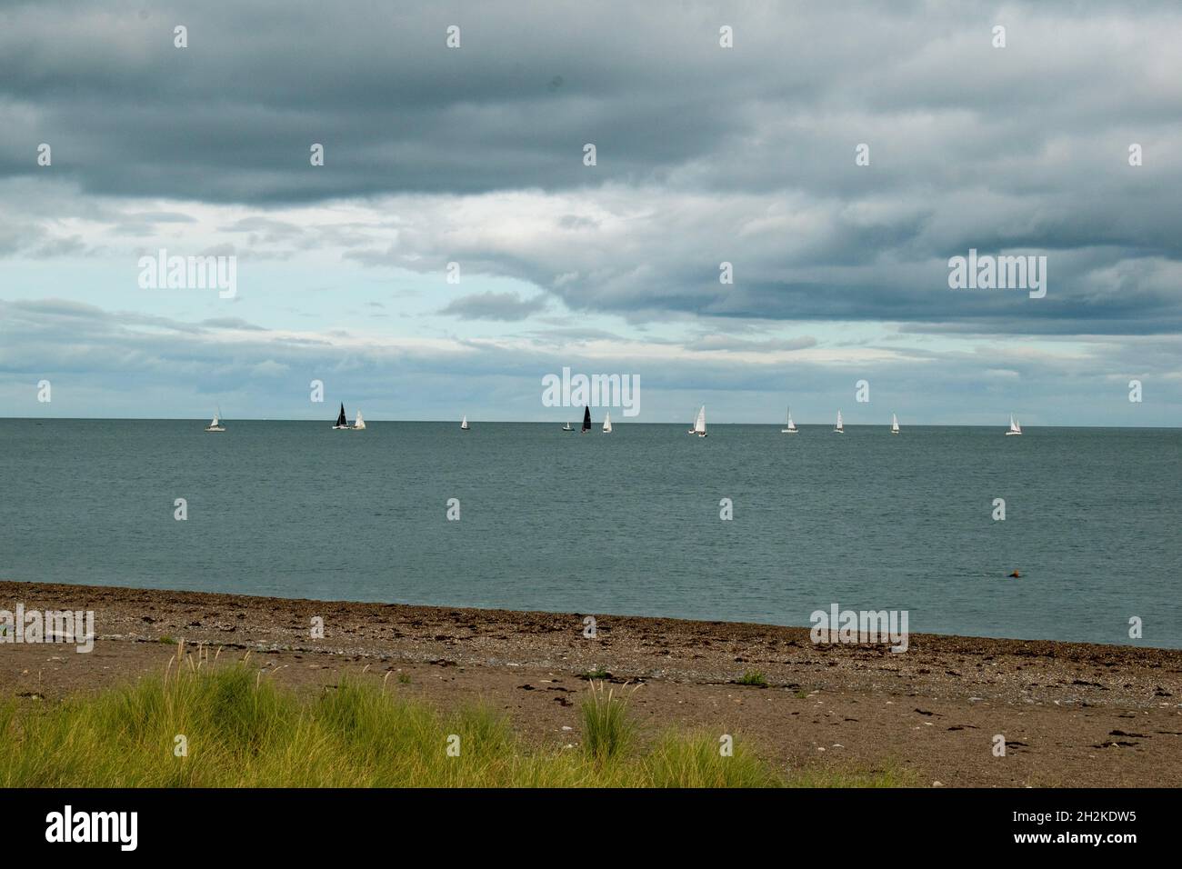 September sailing in the Irish Sea off Greystones on a cloudy day Stock Photo