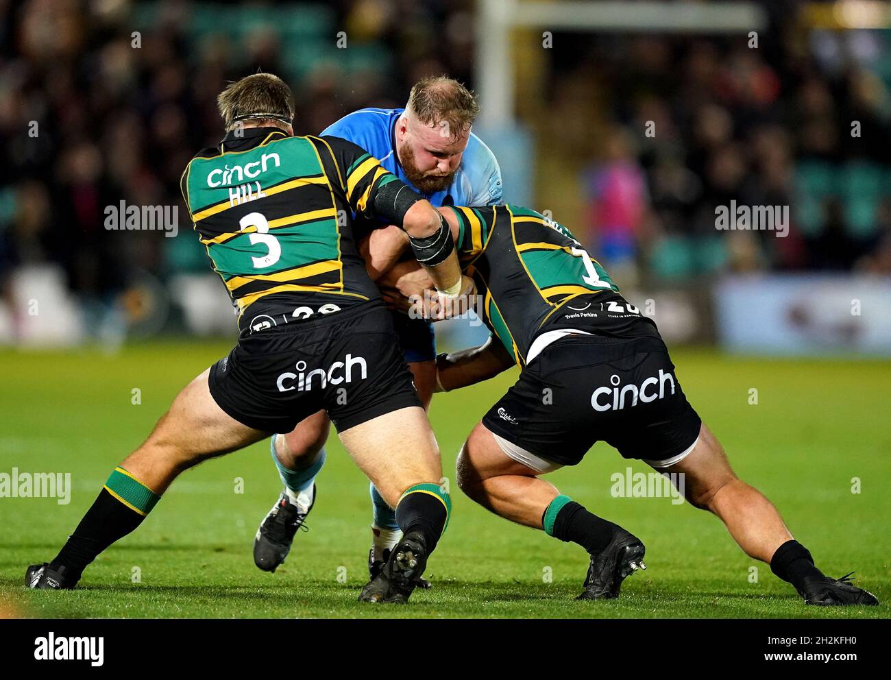 Worcester Warriors' Christian Judge (centre) is tackled by Northampton Saints' Paul Hill (left) and Alex Waller during the Gallagher Premiership match at Franklin's Gardens, Northampton. Picture date: Saturday October 22, 2021. Stock Photo