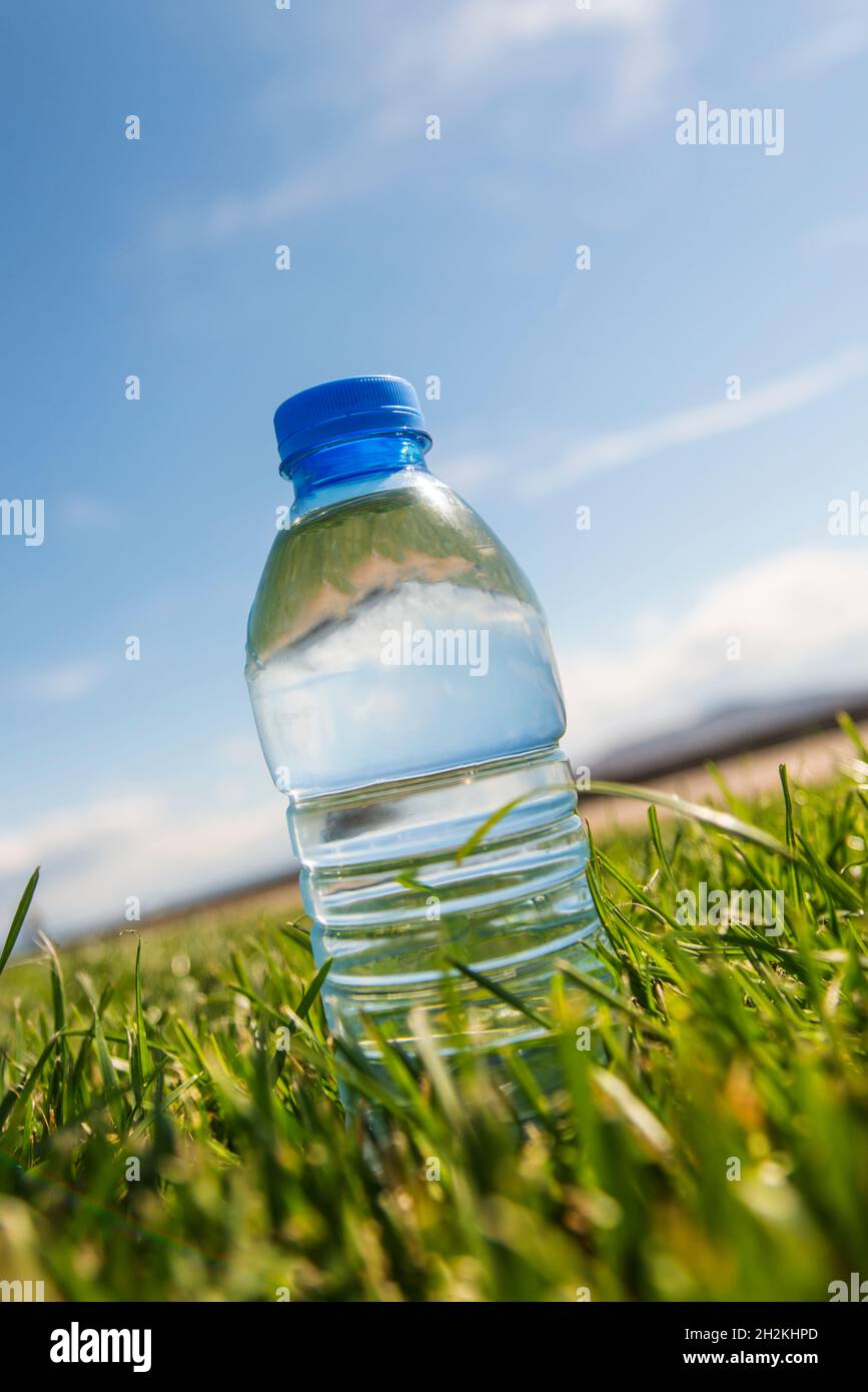 Small bottle of mineral water on trimmed grass Stock Photo - Alamy