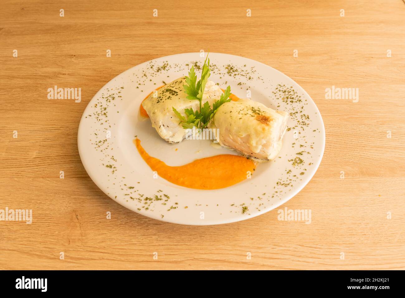 Spanish recipe for confit cod with pumpkin cream and lots of chopped ...