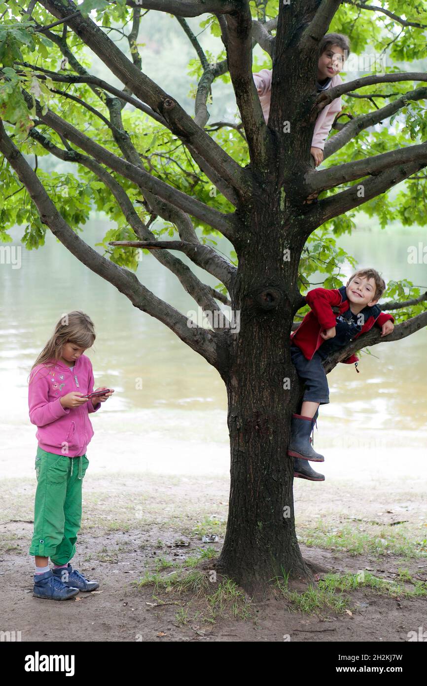 A sevenyearold boy in a red fleece jacket and blue corduroy pants