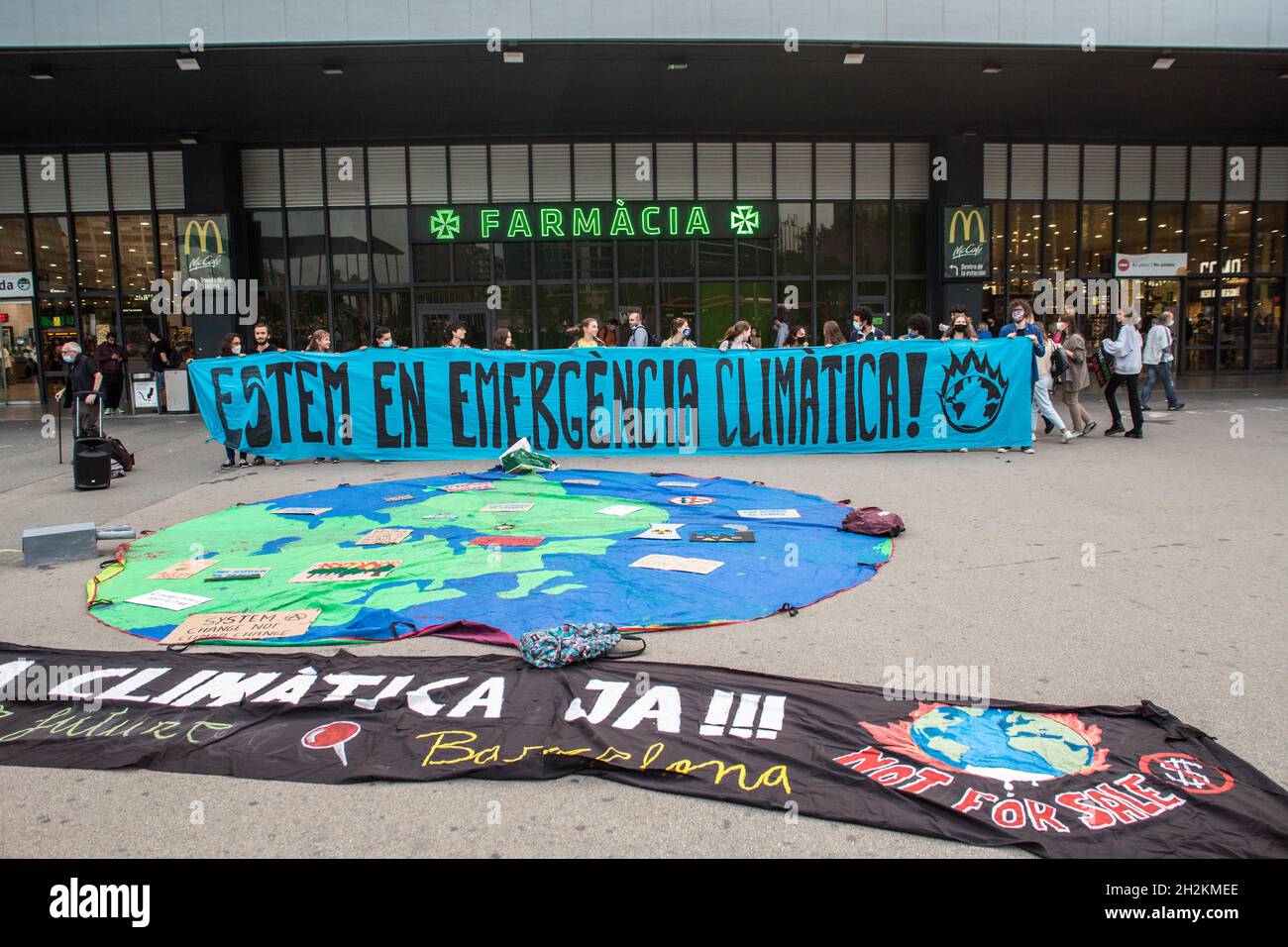 Banners laying on the ground in front of Barcelona Sants railway station during the demonstration.The Friday For Future movement in Barcelona has called a demonstration in front of Barcelona Sants, the main railway station in the city, for the United Nations Conference on Climate Change of 2021, COP26, in which they affirm the majority of proposals for the recovery of mobility after Covid-19 are based on false solutions, such as electric and hydrogen cars. (Photo by Thiago Prudencio / SOPA Images/Sipa USA) Stock Photo