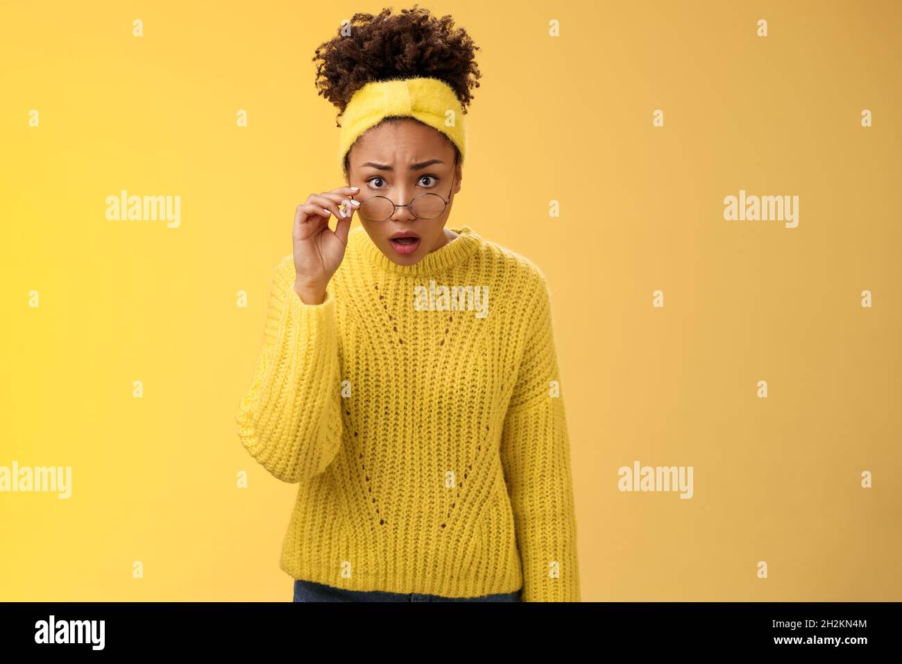 Shocked amazed african-american female student drop jaw gasping concerned confused take-off glasses bending forward reassure see truth, standing Stock Photo