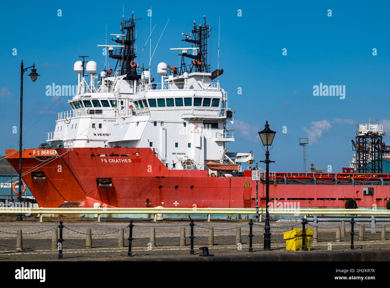 Oil industry working vessels supply ships docked in Leith Harbour on sunny day with blue sky, Edinburgh, Scotland, UK Stock Photo