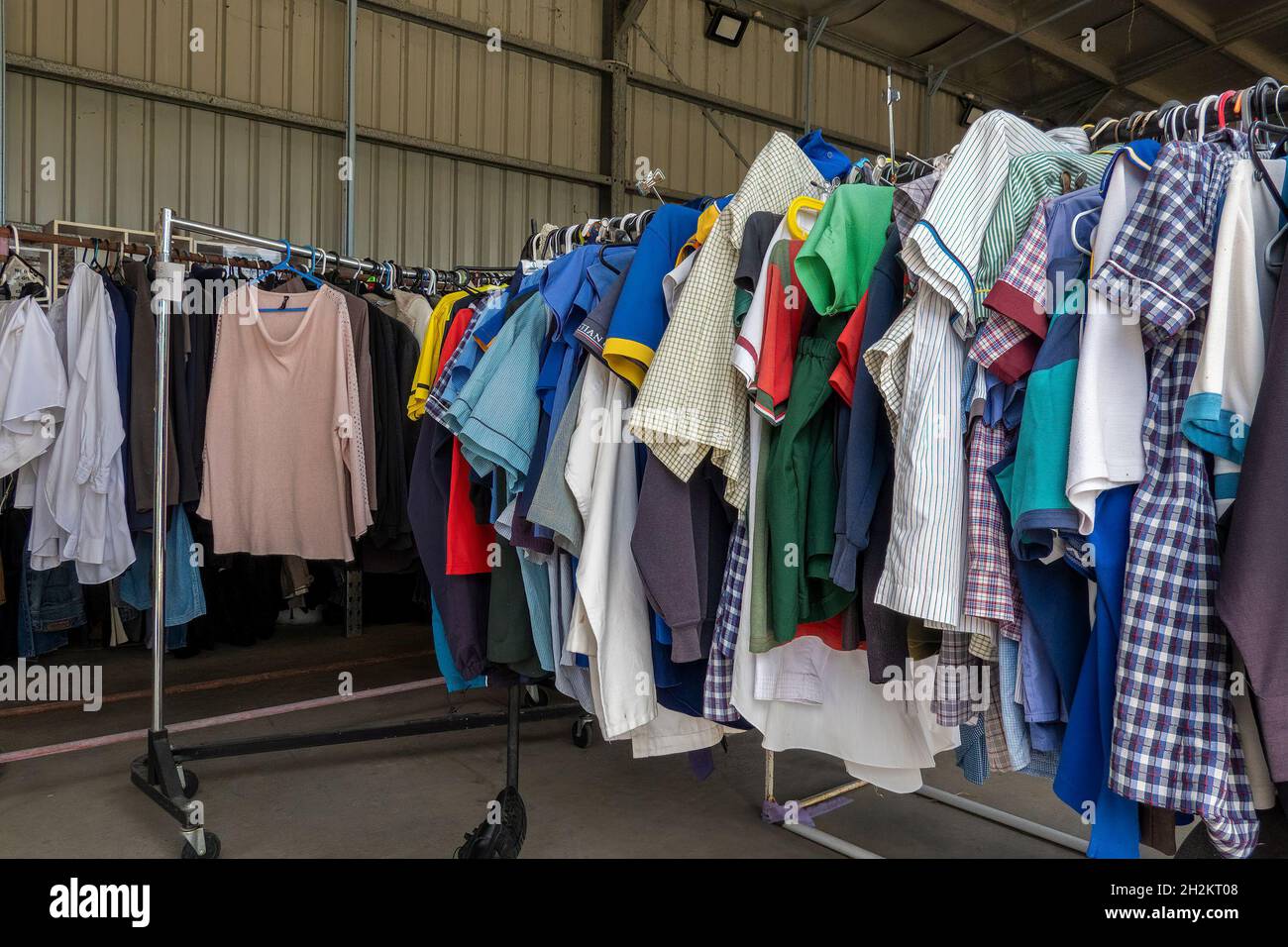 Mackay, Queensland, Australia October 2021 Clothes on racks for sale at local Tip Shop Stock