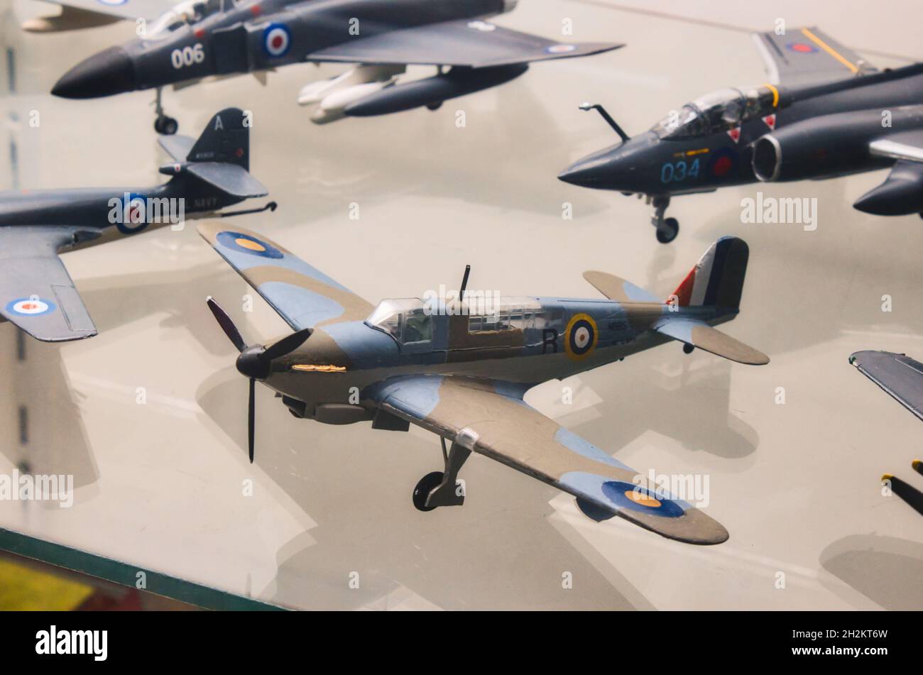 Plastic model military airplanes collection on a glass shelf Stock Photo