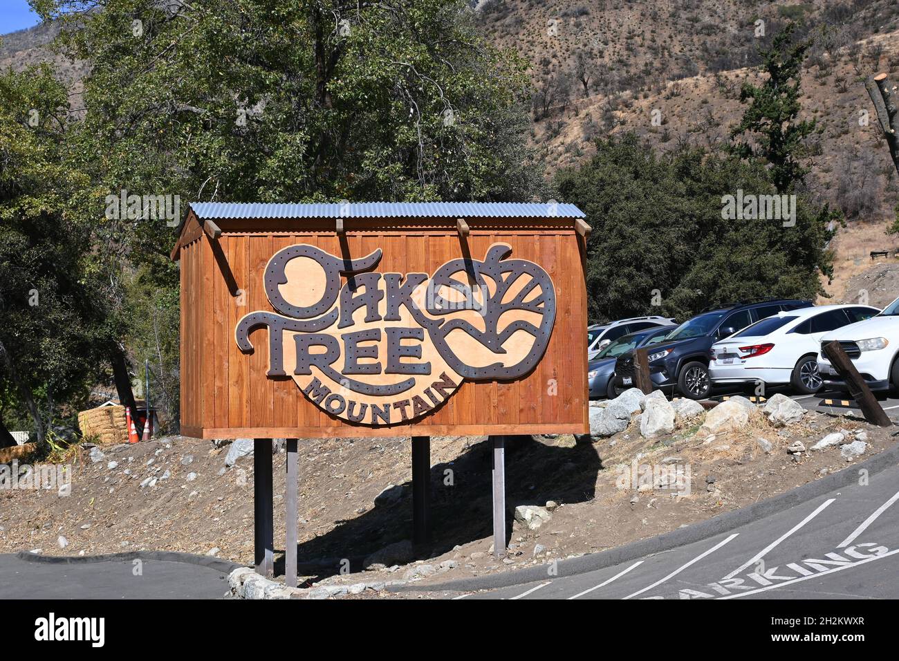 OAK GLEN, CALIFORNIA - 10 OCT 2021: Sign at Oak Tree Mountain established 50 years ago as a small apple shed has grown to be a 14- acre family fun par Stock Photo