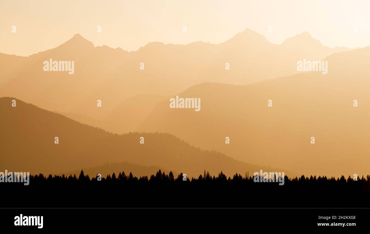 Muti layers mountains in the haze of sunset near Mammoth Lakes. Stock Photo