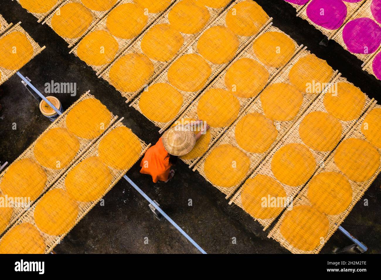 Workers are drying rice noodles in the sun Stock Photo - Alamy