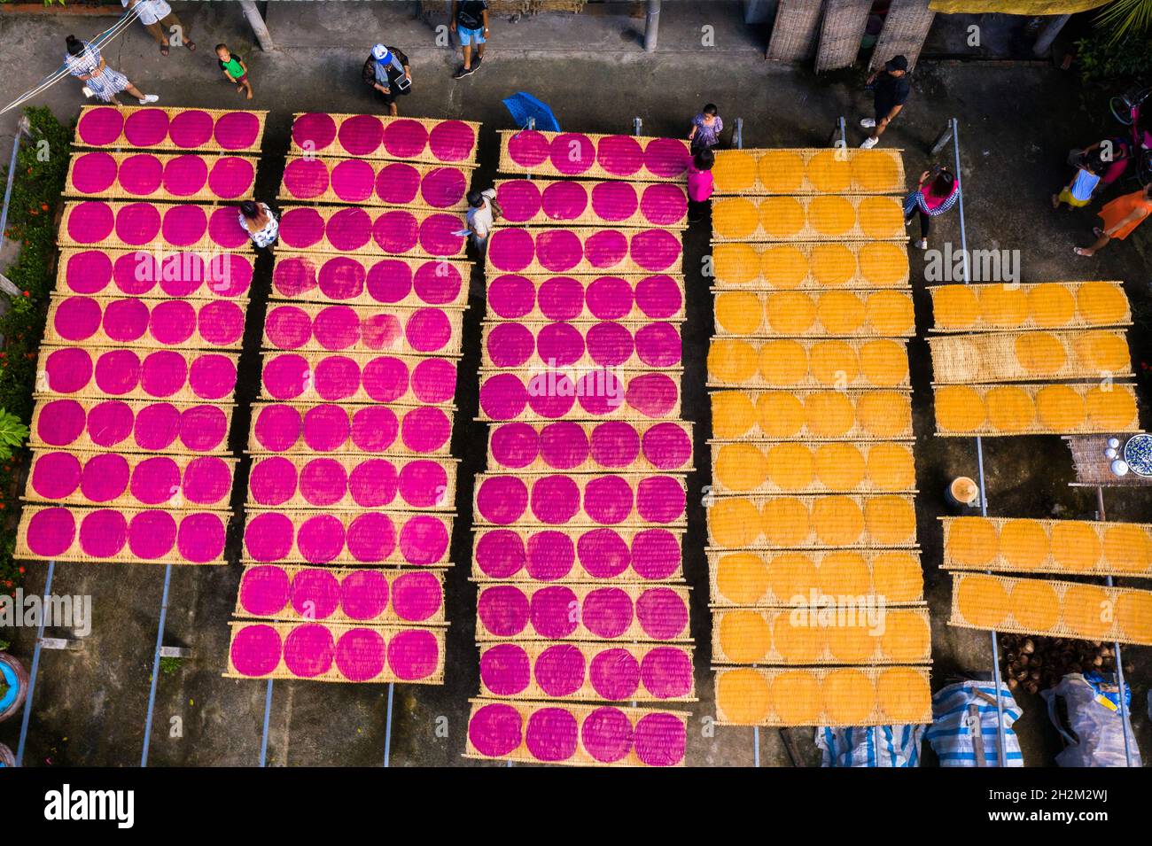 Workers are drying rice noodles in the sun Stock Photo - Alamy