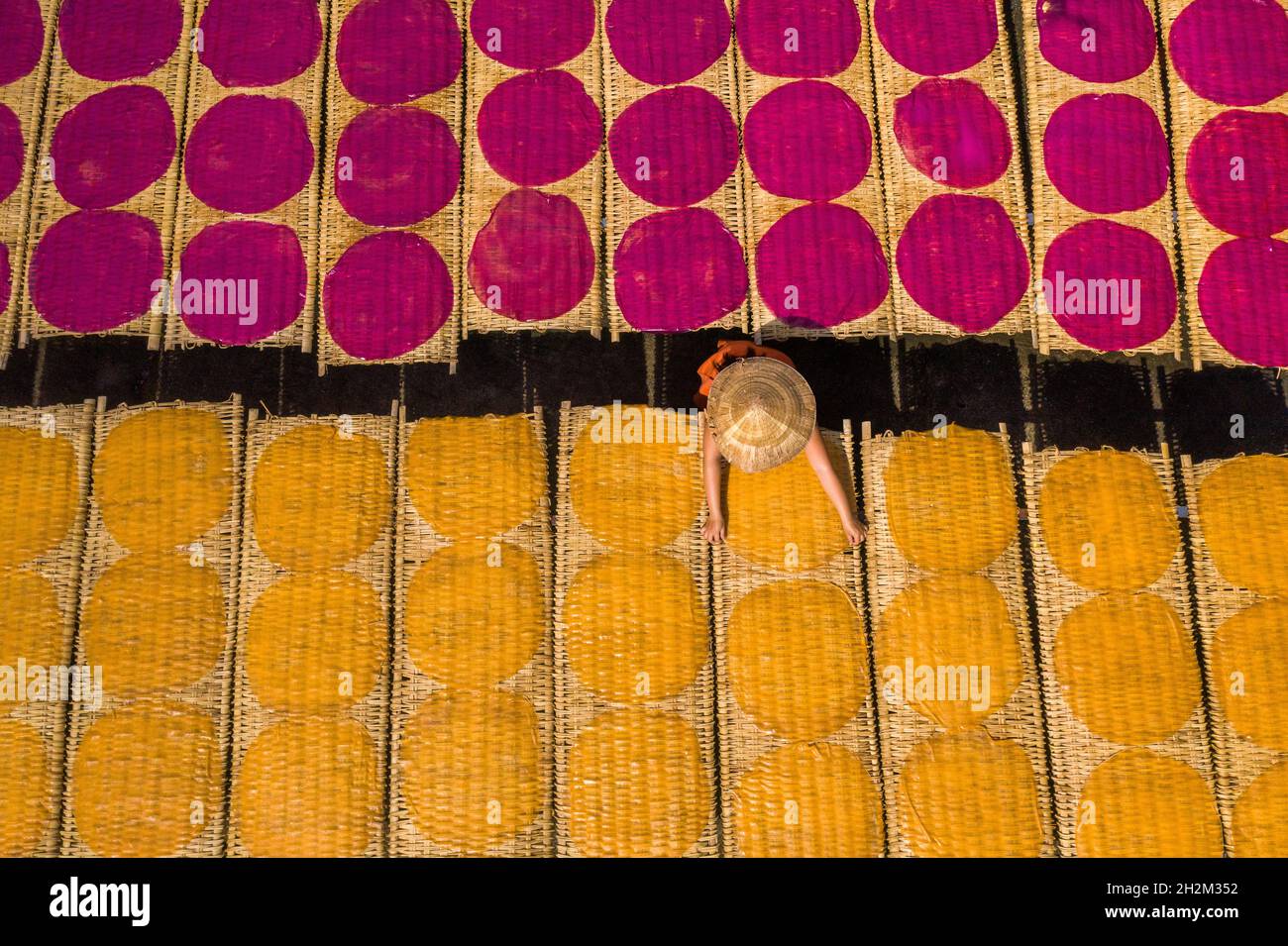 Workers are drying rice noodles in the sun Stock Photo - Alamy