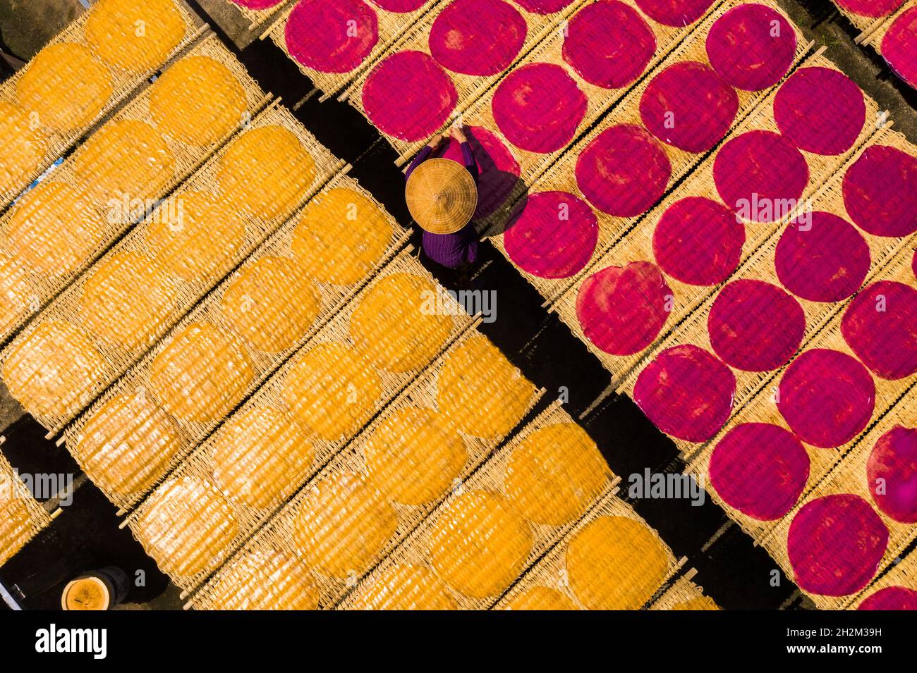 Workers are drying rice noodles in the sun Stock Photo - Alamy