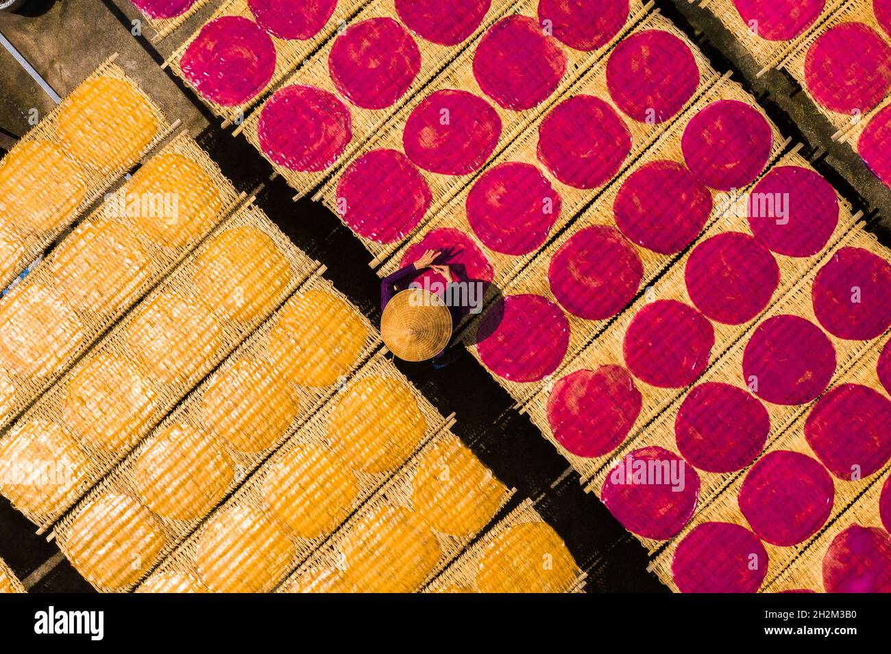 Workers are drying rice noodles in the sun Stock Photo - Alamy