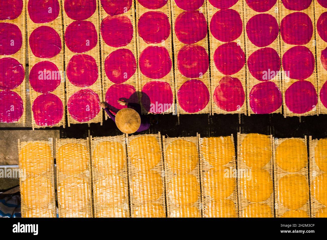 Workers are drying rice noodles in the sun Stock Photo - Alamy