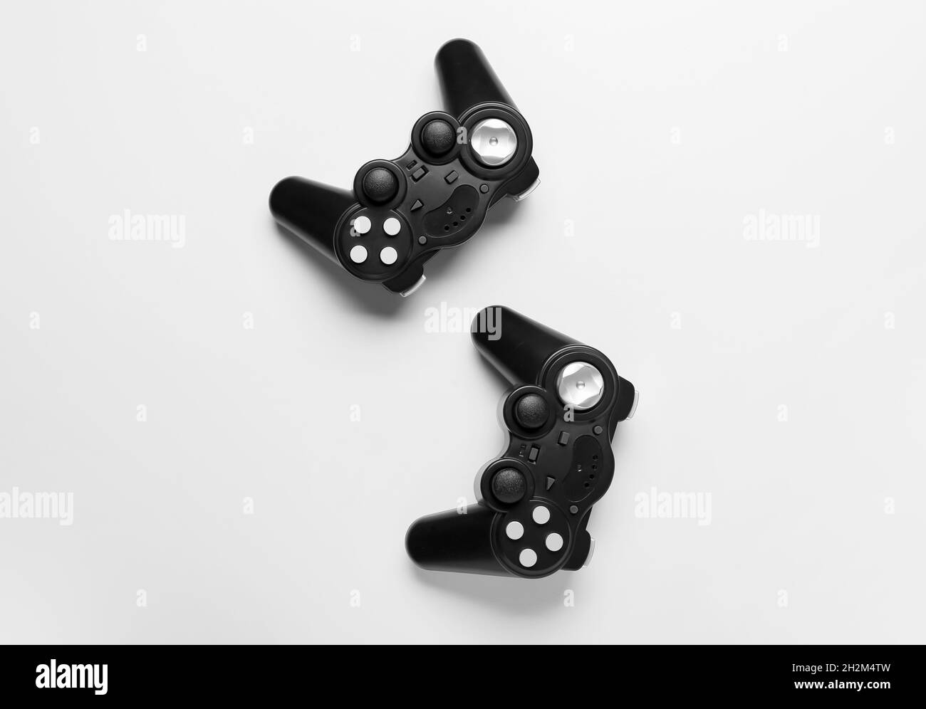 Modern joysticks on white background Stock Photo - Alamy