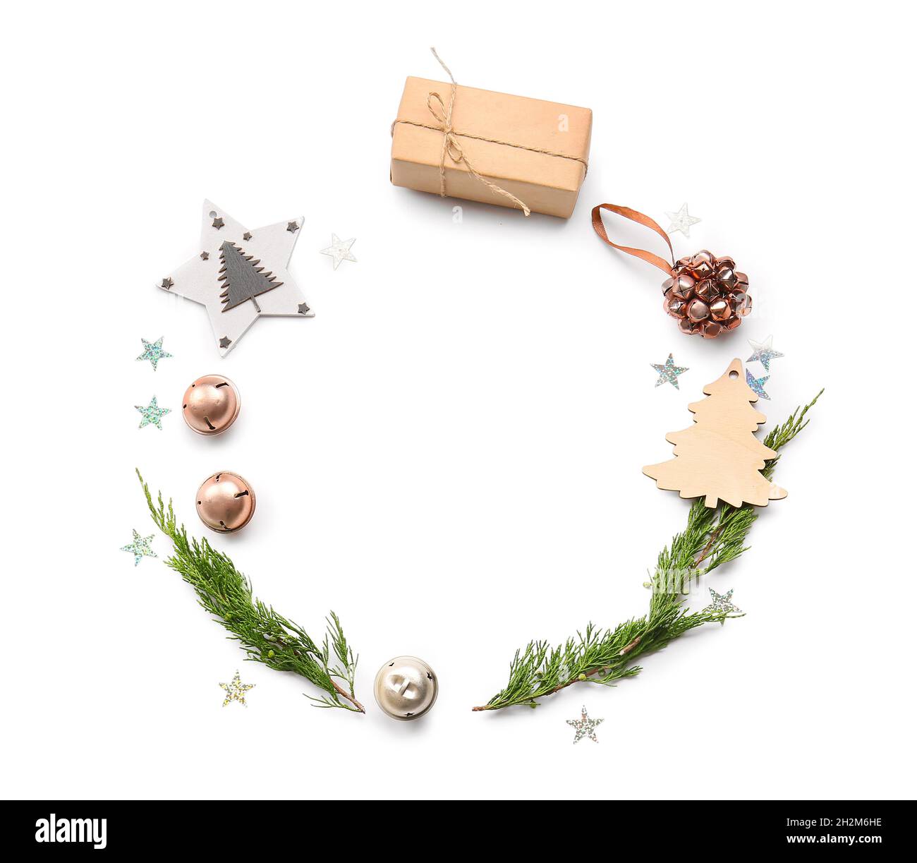 Frame made of different Christmas decor and fir tree branches on white ...