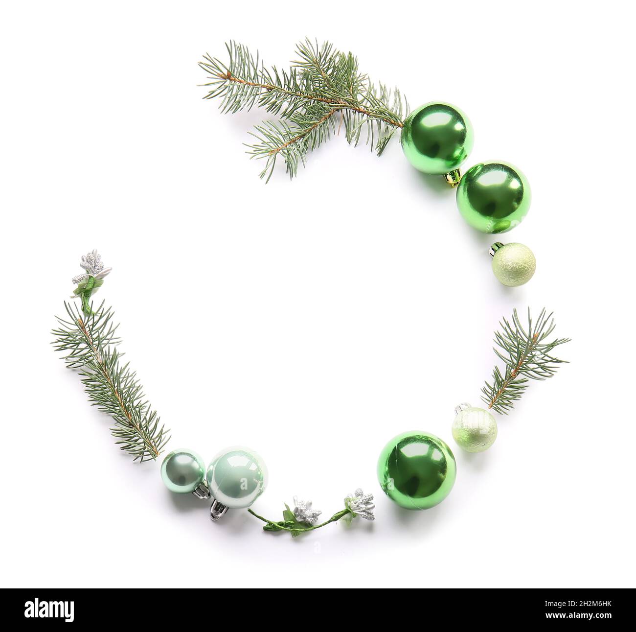 Frame made of balls and fir tree branches on white background Stock ...