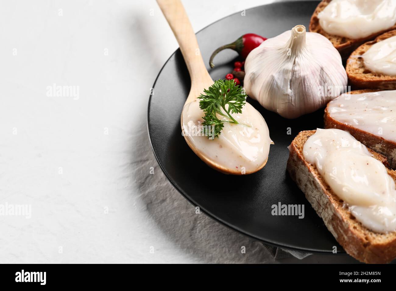 Plate of bread with lard spread on white background, closeup Stock Photo Alamy