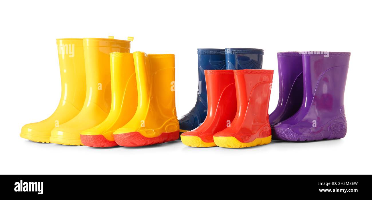 Many rubber rain boots isolated on white background Stock Photo - Alamy