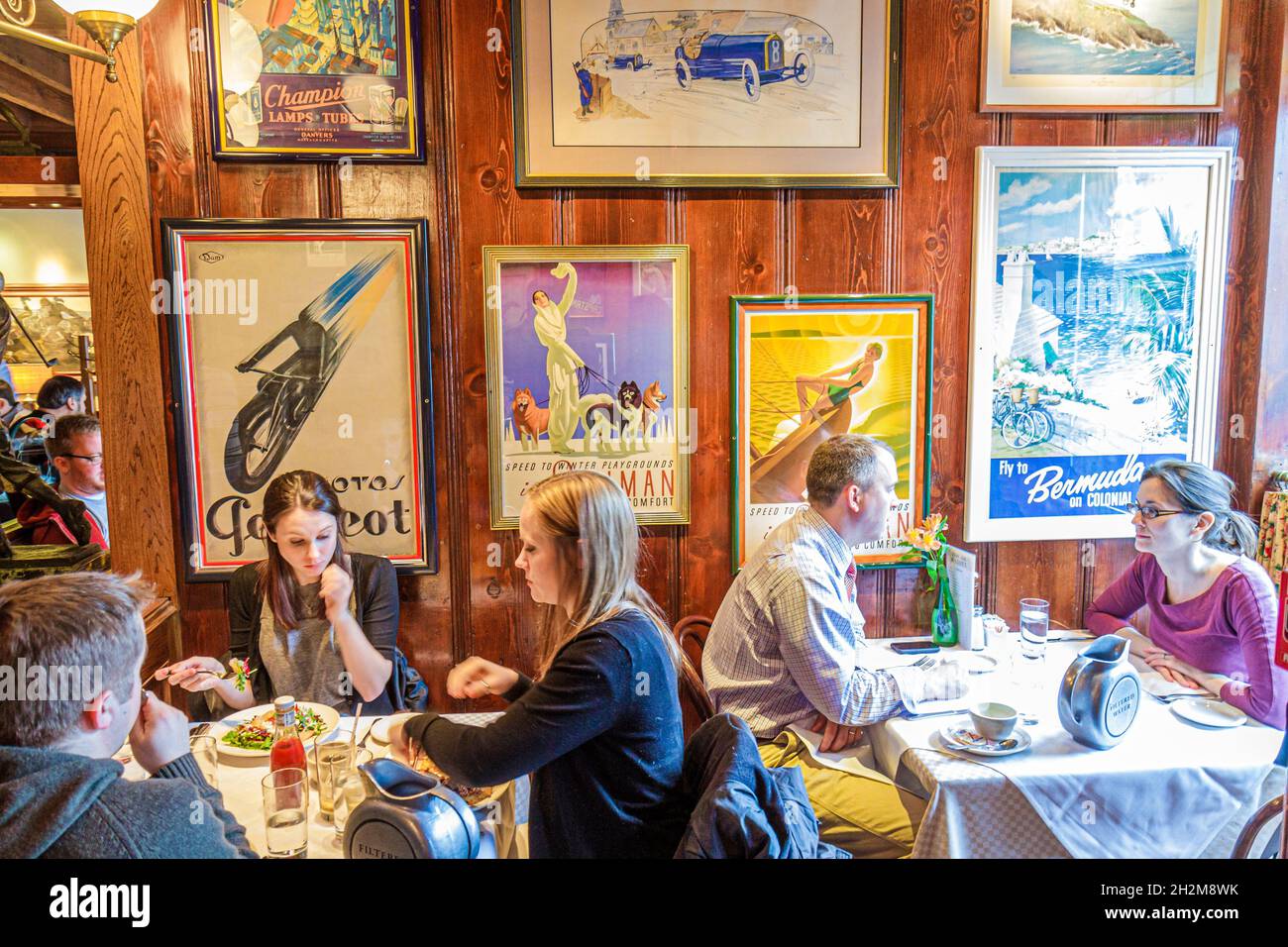 Washington DC,M Street,Clyde's of Georgetown restaurant inside interior,man male woman female women couple dining tables eating Stock Photo
