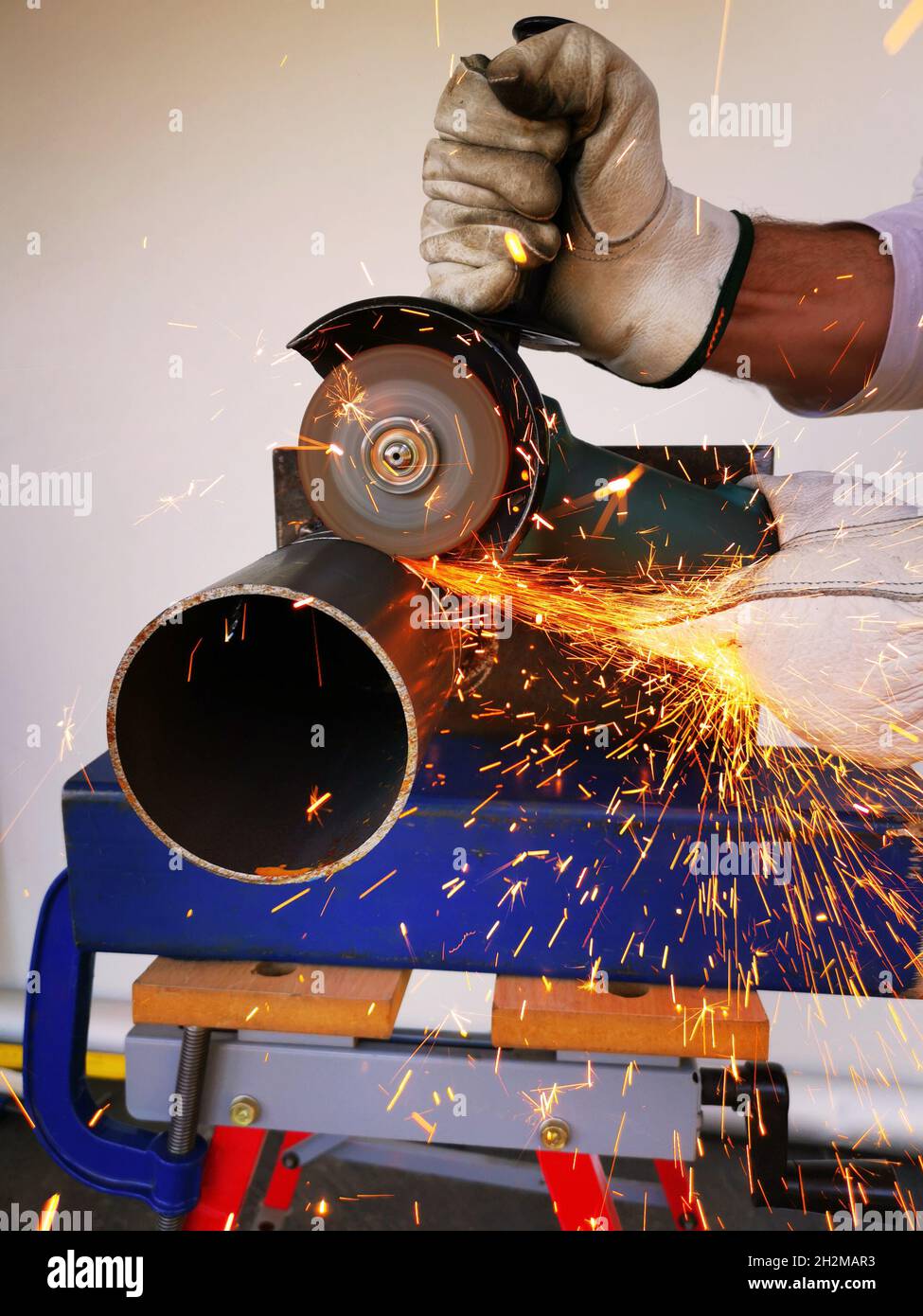 Angle grinder cutting through a piece of metal Stock Photo Alamy