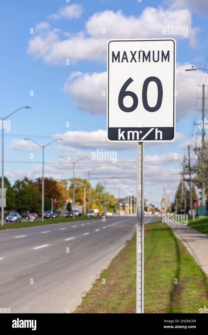 Speed limit road sign in the street, driving 60 km maximum in Ottawa