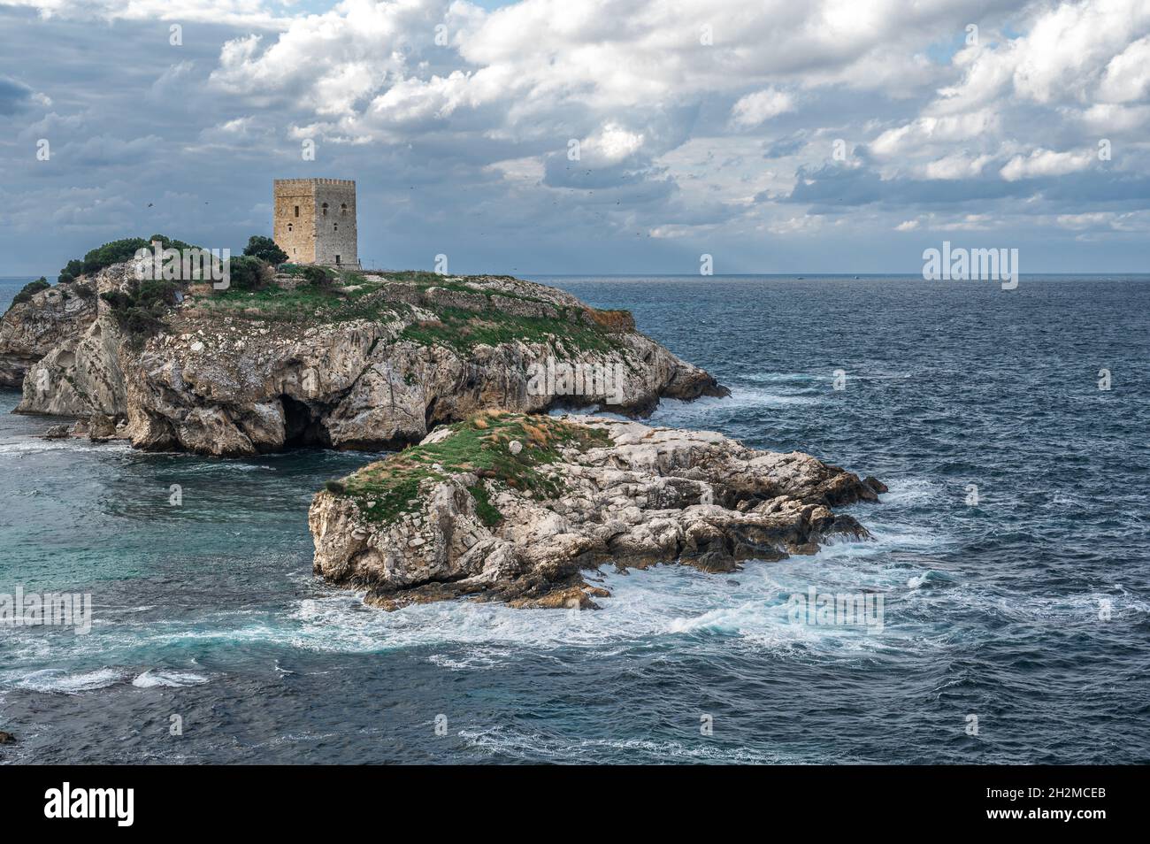 Old fortress on green island inside the sea. Old castle in sea, ocean with a beautiful sky in background. Sile, Istanbul, Turkey Stock Photo