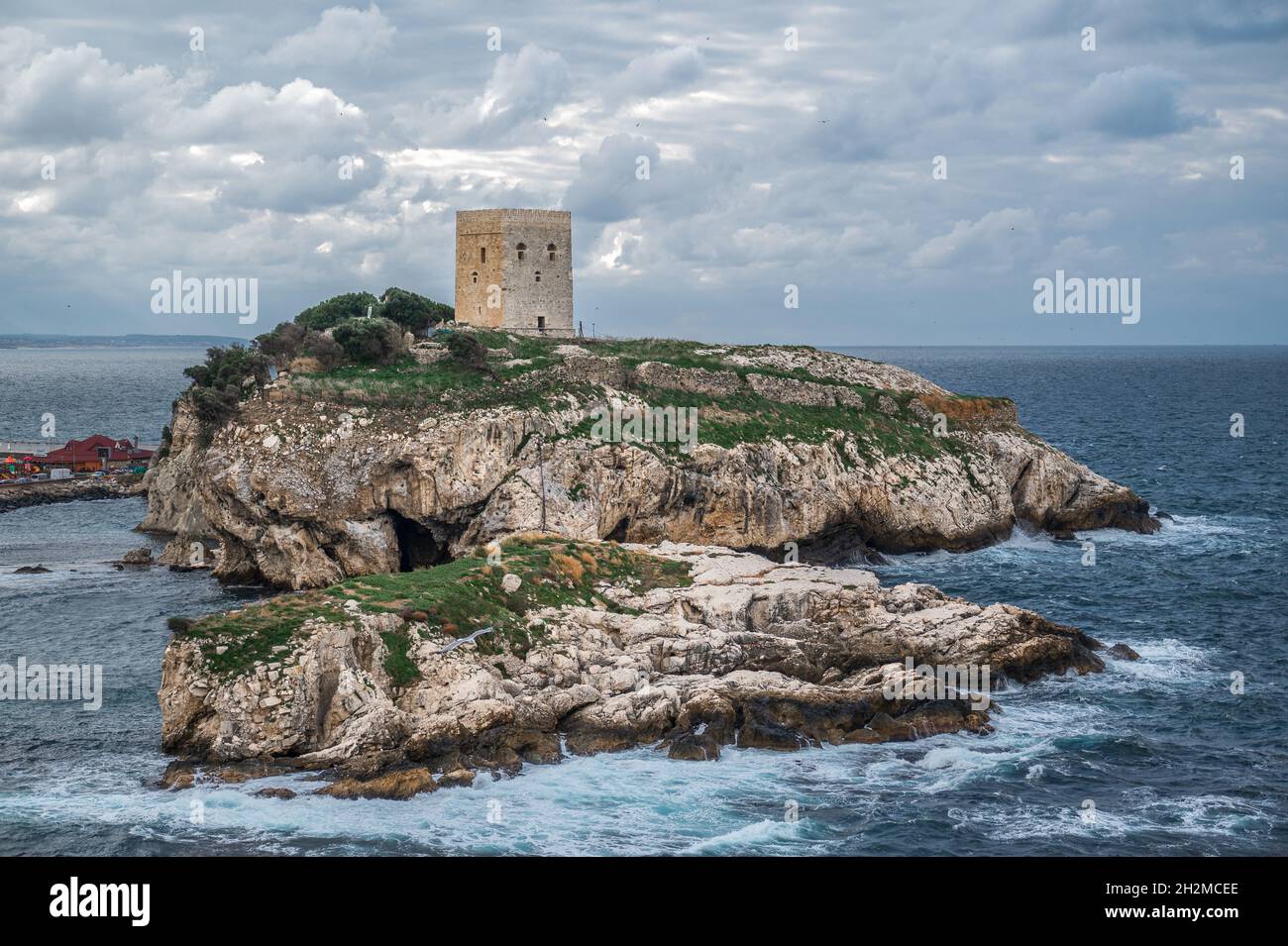 Old fortress on green island inside the sea. Old castle in sea, ocean with a beautiful sky in background. Sile, Istanbul, Turkey Stock Photo