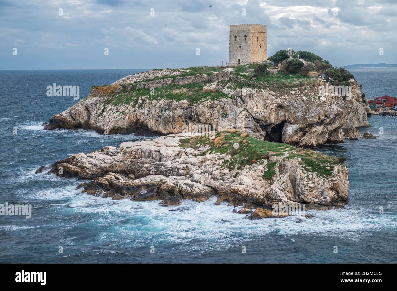 Old fortress on green island inside the sea. Old castle in sea, ocean with a beautiful sky in background. Sile, Istanbul, Turkey Stock Photo