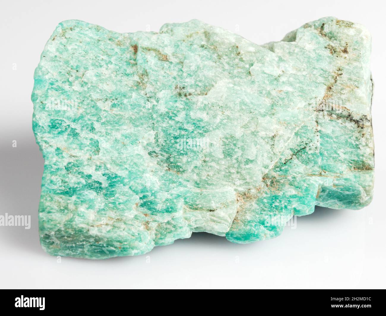 Amazonite on a white background. Exotic ornamental stone. Stock Photo