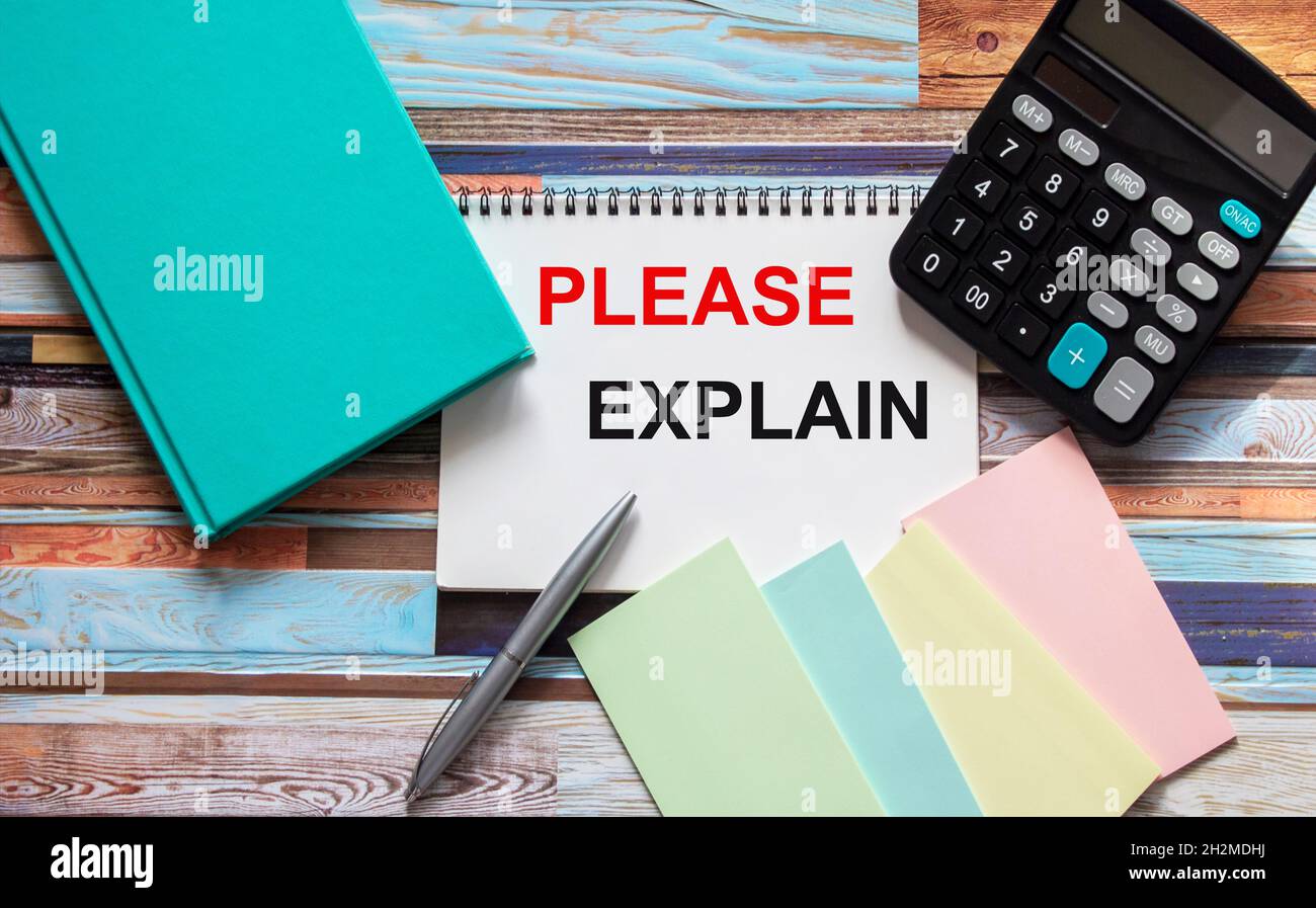 Please explain, text on a notebook, calculator, stickers, diary on a wooden table. Stock Photo
