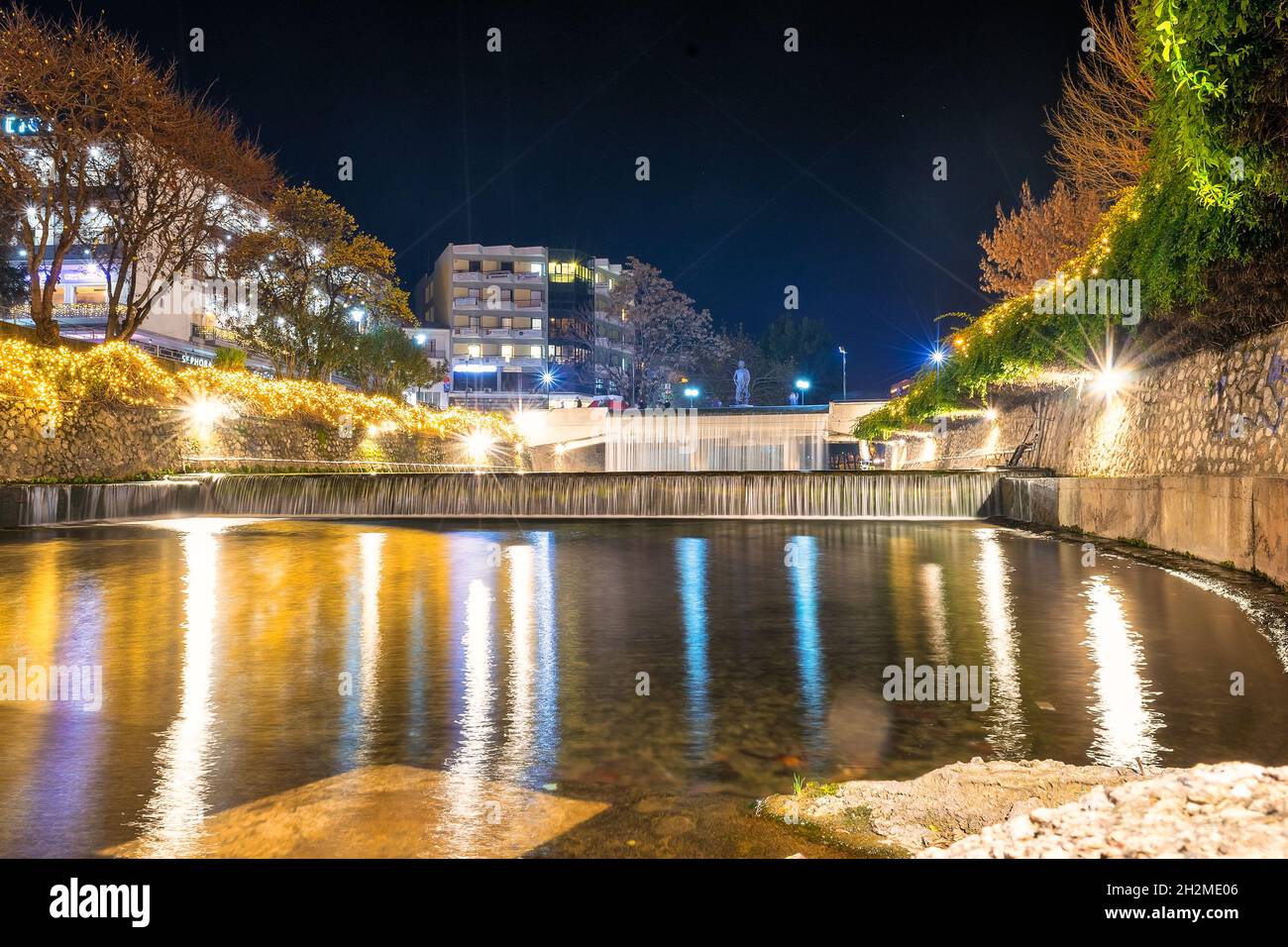 Trikala, Greece 27 December 2019.  Lithaios river in Trikala with the waterfalls. Stock Photo