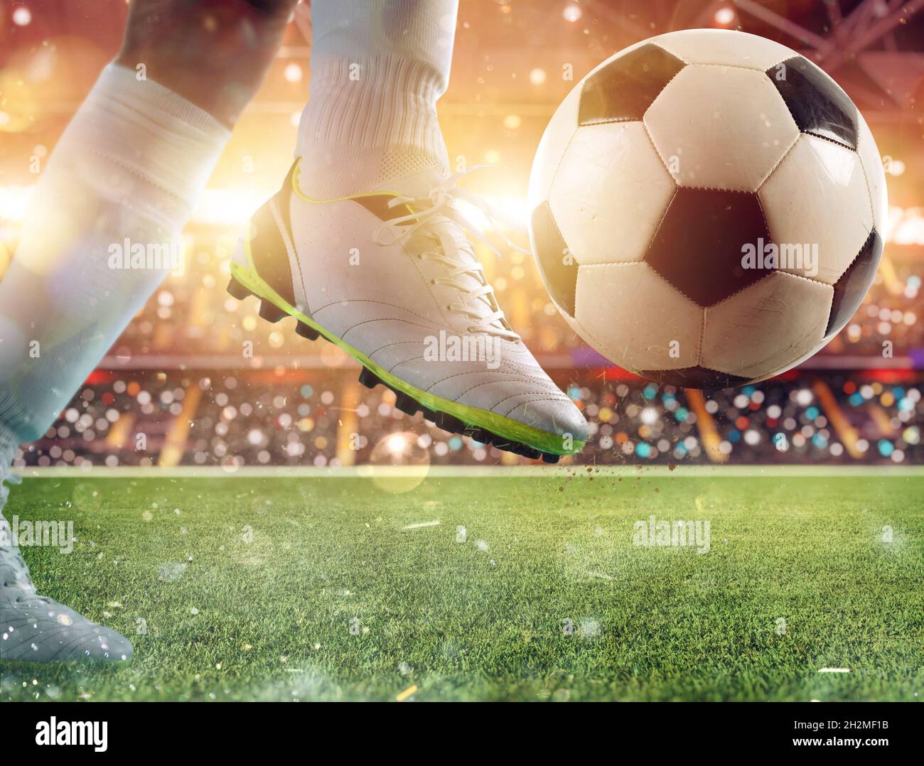 Soccer player ready to kicks the ball at the stadium Stock Photo