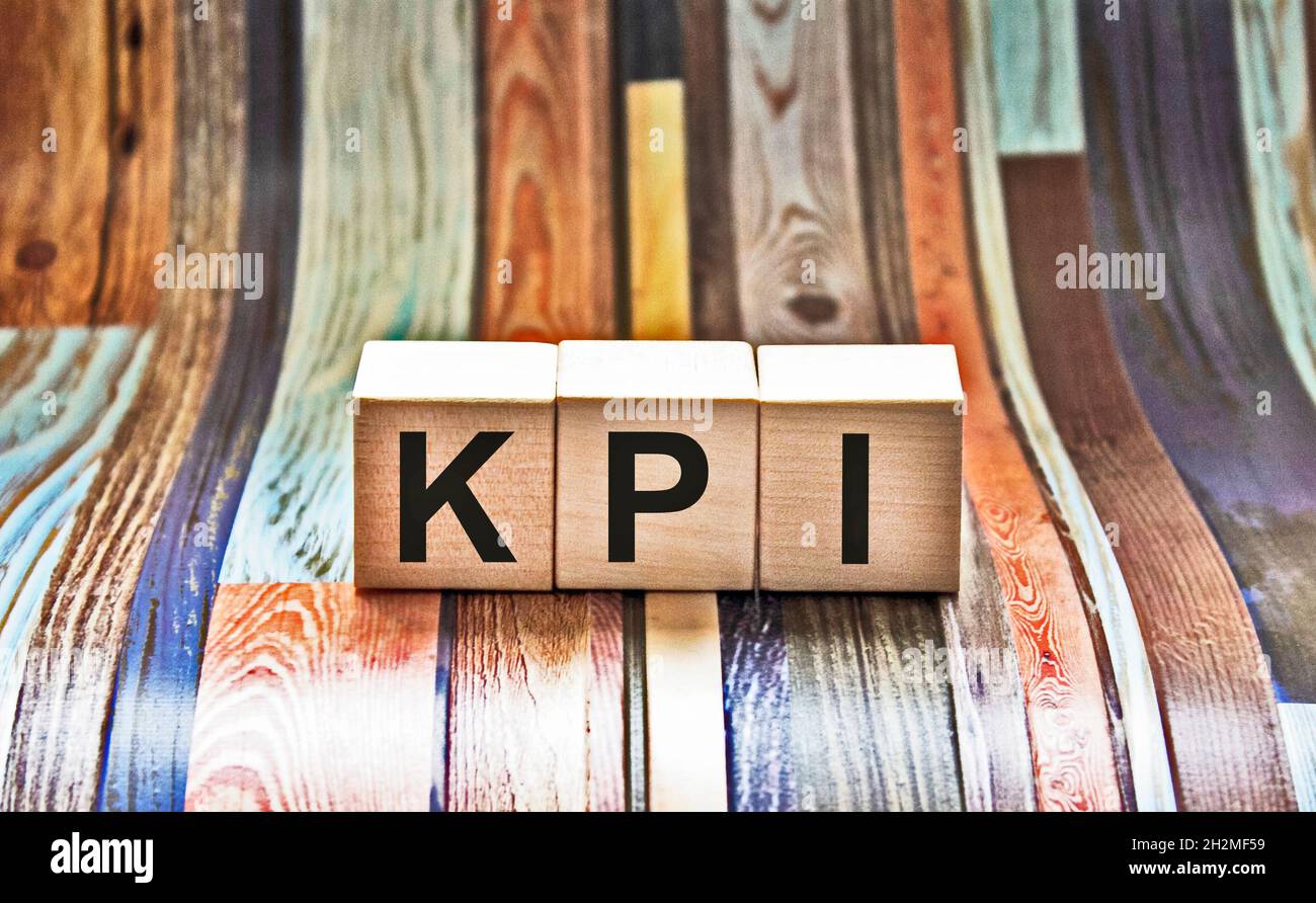 KPI - wooden blocks with letters, key performance indicator KPI concept, top view on grey background Stock Photo