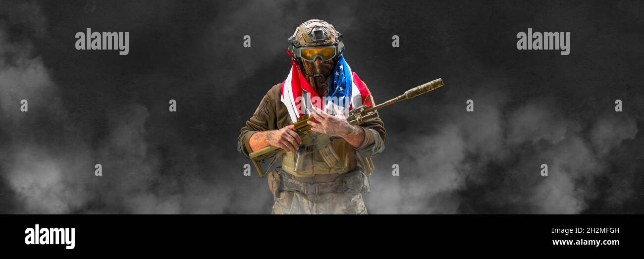 An American infantry soldier stands against the background of a ...