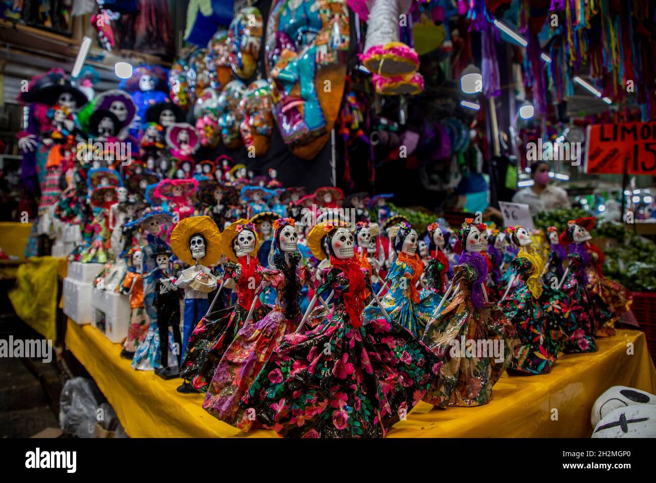 Mexiko Stadt, Mexico. 19th Oct, 2021. Small figurines of skeletons and 'catrinas' are sold before the Day of the Dead at the traditional market 'Jamaica'. In Mexico, the Day of the Dead is a contemplative holiday. For it, altars are erected and decorated in houses and apartments. (to dpa 'Between tradition and marketing: The reinvention of the Day of the Dead') Credit: Jair Cabrera Torres/dpa/Alamy Live News Stock Photo