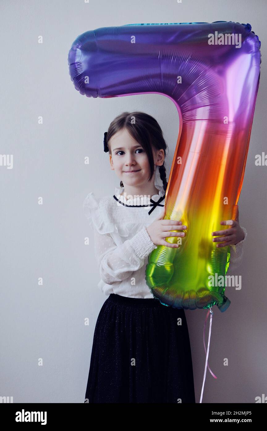 Cute little girl wiht happy birthday ballon Stock Photo
