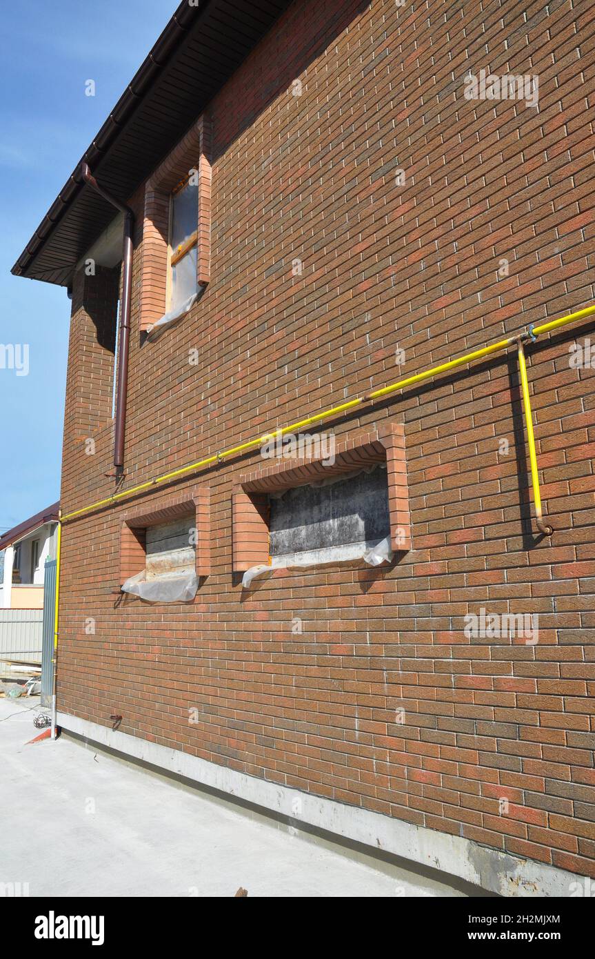 Closeup on Gas Pipe Line System Connection Installed in House Wall