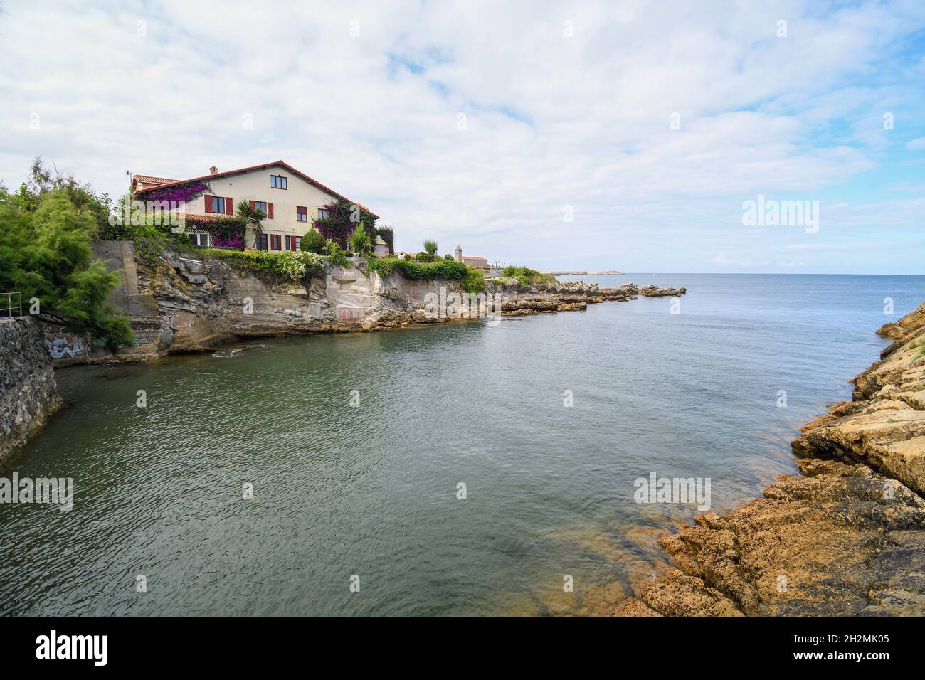 Houses on the edge of the sea in Luanco, Asturias Stock Photo