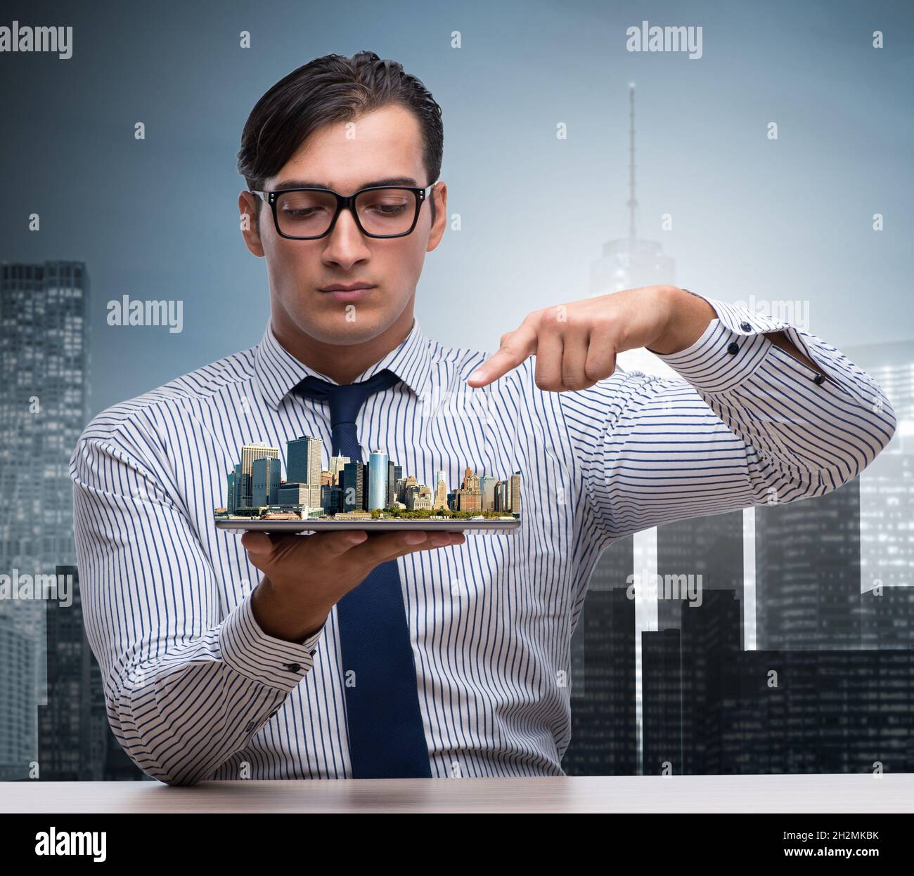 The businessman in urban planning concept Stock Photo Alamy