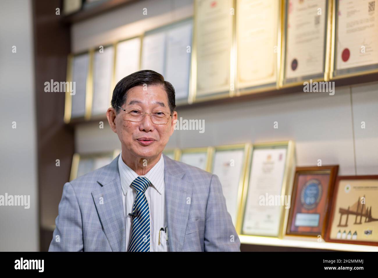 Kuala Lumpur, Malaysia. 20th Oct, 2021. Lim Kuang Sia, founder of Malaysia rubber manufacturer Kossan Rubber Industries, speaks during an interview with Xinhua in Klang, Selangor state, Malaysia, Oct. 20, 2021. TO GO WITH 'Interview: CIIE weaves integration of world economies, benefits all in global economic recovery' Credit: Zhu Wei/Xinhua/Alamy Live News Stock Photo