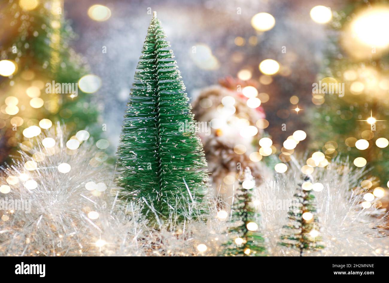 Toy snowman and Christmas tree winter holiday festive background and ornaments Stock Photo