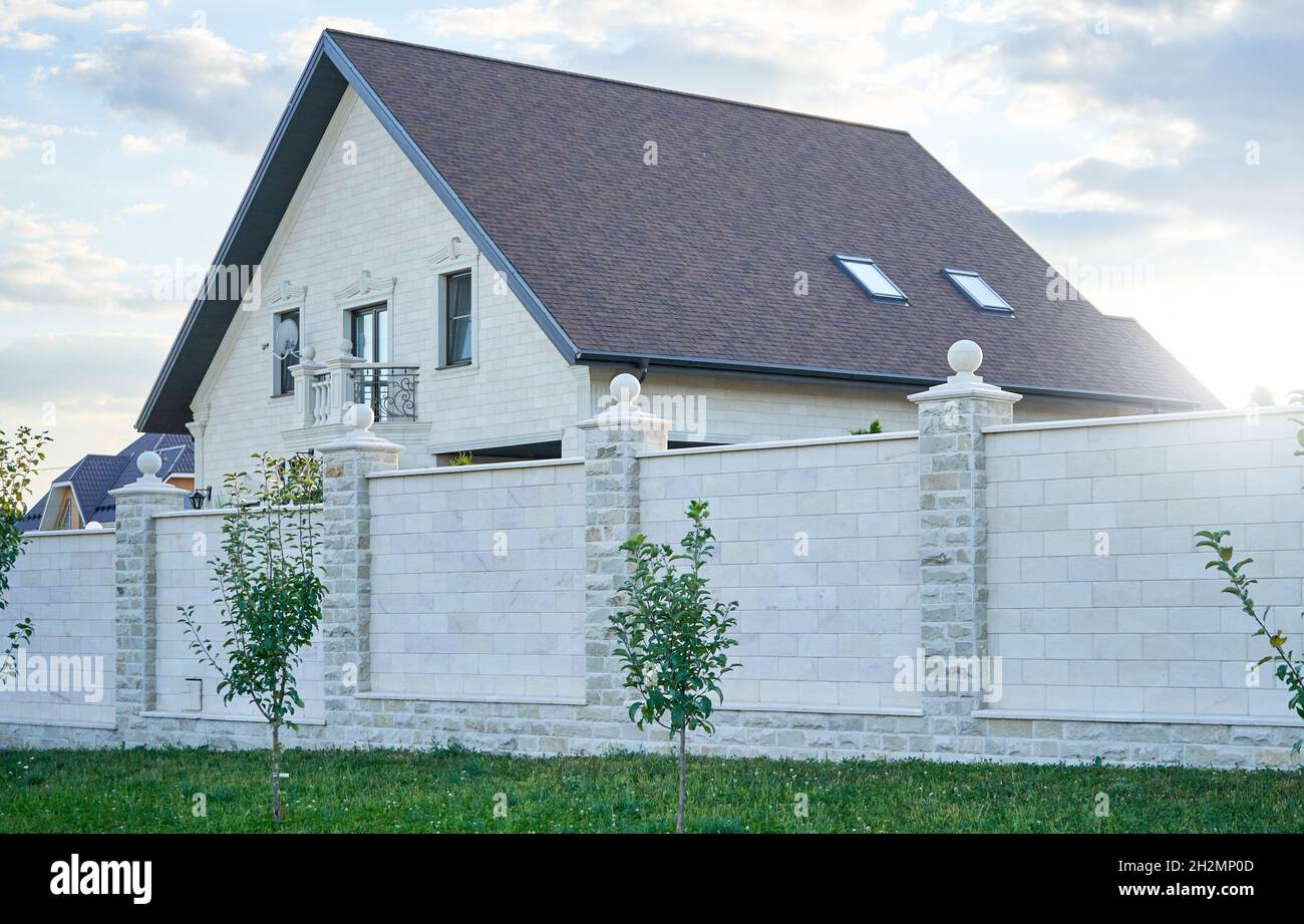 White stone fence in a private house. Stock Photo